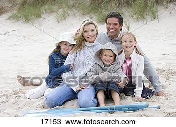 Stock Photo - portrait of young 
family on beach. 
fotosearch - search 
stock photos, 
pictures, images, 
and photo clipart