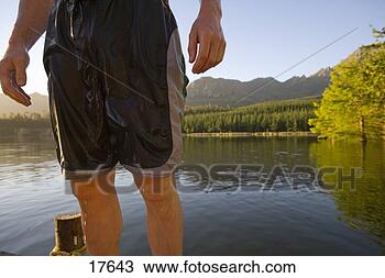 Stock Photo - midsection of 
man in wet swim 
trunks. fotosearch 
- search stock 
photos, pictures, 
images, and photo 
clipart