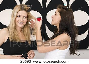 Stock Photo - two young women 
styling each others 
hair. fotosearch 
- search stock 
photos, pictures, 
images, and photo 
clipart