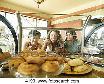Stock Photograph - three young women 
staring at pastries 
on display in 
cafe,  one woman. 
fotosearch - search 
stock photos, 
pictures, images, 
and photo clipart