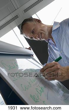 Stock Photography - businessman writing 
on whiteboard 
with pen,  smiling, 
 close-up. fotosearch 
- search stock 
photos, pictures, 
images, and photo 
clipart