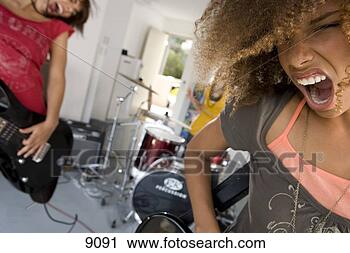 Stock Photography - three teenage 
girls (15-17) 
in garage band, 
 teenage girl 
singing in. fotosearch 
- search stock 
photos, pictures, 
images, and photo 
clipart