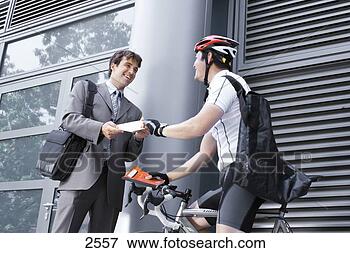 Picture - bicycle courier 
delivering package 
to businessman, 
 smiling,  side. 
fotosearch - search 
stock photos, 
pictures, images, 
and photo clipart