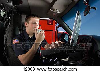 Stock Photo - paramedic in cab 
of ambulance, 
 using communication 
equipment,  low. 
fotosearch - search 
stock photos, 
pictures, images, 
and photo clipart