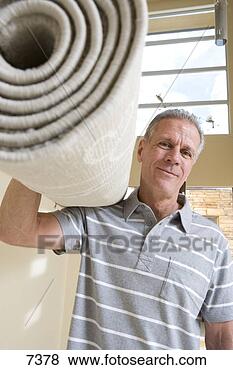 Stock Photo - senior man carrying 
rolled-up carpet 
on shoulder,  
moving house. 
fotosearch - search 
stock photos, 
pictures, images, 
and photo clipart