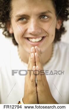 Stock Photo - man smiling with 
folded hands. 
fotosearch - search 
stock photos, 
pictures, images, 
and photo clipart