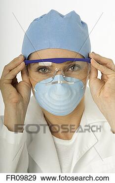 Stock Photograph - surgeon putting 
on protective 
eyewear, portrait. 
fotosearch - search 
stock photos, 
pictures, images, 
and photo clipart