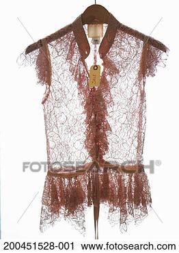 Stock Photography - lace blouse on 
hanger. fotosearch 
- search stock 
photos, pictures, 
images, and photo 
clipart