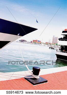 Stock Photo - boat anchored 
at a harbor. fotosearch 
- search stock 
photos, pictures, 
images, and photo 
clipart
