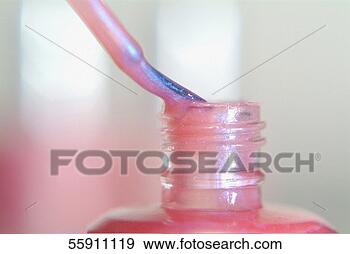 Stock Photograph - close-up of a 
bottle of pink 
nail polish. fotosearch 
- search stock 
photos, pictures, 
images, and photo 
clipart