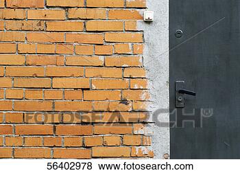 Stock Photo - close-up of a 
brick wall and 
a closed door. 
fotosearch - search 
stock photos, 
pictures, images, 
and photo clipart