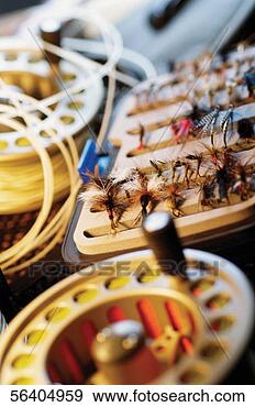 Stock Photograph - close-up of fishing 
lures and a fishing 
reel. fotosearch 
- search stock 
photos, pictures, 
images, and photo 
clipart