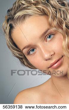 Stock Photo - close-up of a 
young woman with 
curly blond hair. 
fotosearch - search 
stock photos, 
pictures, images, 
and photo clipart