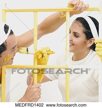 Stock Photo - couple painting 
a window frame. 
fotosearch - search 
stock photos, 
pictures, images, 
and photo clipart