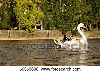 Stock Photo - group of people 
boating in a swan 
shaped boat,  
vltava river. 
fotosearch - search 
stock photos, 
pictures, images, 
and photo clipart