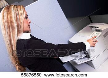 Stock Photography - headshot of young 
blonde female 
office worker 
at copier. fotosearch 
- search stock 
photos, pictures, 
images, and photo 
clipart