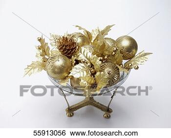 Stock Photo - high angle view 
of golden christmas 
decorations in 
a glass holder. 
fotosearch - search 
stock photos, 
pictures, images, 
and photo clipart