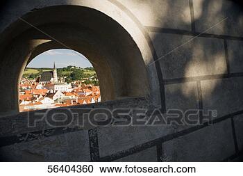 Stock Photography - high angle view 
of buildings in 
a city viewed 
through an arch. 
fotosearch - search 
stock photos, 
pictures, images, 
and photo clipart