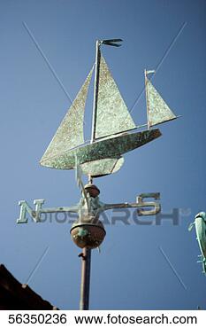 Stock Photo - low angle view 
of a boat shaped 
weather vane, 
 san diego. fotosearch 
- search stock 
photos, pictures, 
images, and photo 
clipart