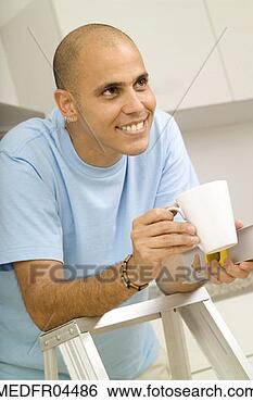 Stock Photo - man leaning against 
stool and laughing. 
fotosearch - search 
stock photos, 
pictures, images, 
and photo clipart