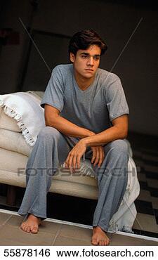 Stock Photo - man sitting on 
bed, looking away. 
fotosearch - search 
stock photos, 
pictures, images, 
and photo clipart