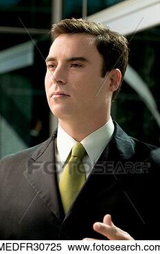 Stock Image - mid adult businessman 
staring. fotosearch 
- search stock 
photos, pictures, 
images, and photo 
clipart