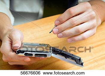 Stock Photo - person operating 
an electronic 
organizer. fotosearch 
- search stock 
photos, pictures, 
images, and photo 
clipart