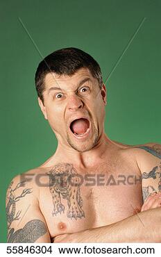 Stock Photo - portrait of a 
man standing with 
his open and tattoos 
on chest. fotosearch 
- search stock 
photos, pictures, 
images, and photo 
clipart