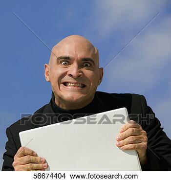 Stock Photo - portrait of a 
mid adult man 
clenching his 
teeth in anger. 
fotosearch - search 
stock photos, 
pictures, images, 
and photo clipart