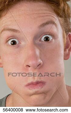 Stock Photo - red-haired young 
man making a face. 
fotosearch - search 
stock photos, 
pictures, images, 
and photo clipart