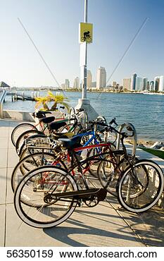 Stock Photograph - side profile of 
bicycles parked 
on a pier,  san 
diego bay,  coronado. 
fotosearch - search 
stock photos, 
pictures, images, 
and photo clipart