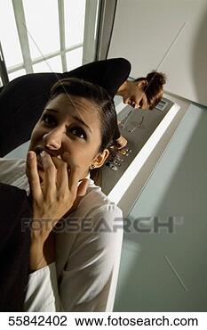 Stock Photo - smiling businesswoman 
pushing elevator 
button and another. 
fotosearch - search 
stock photos, 
pictures, images, 
and photo clipart