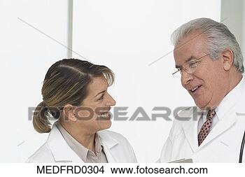 Stock Photo - two doctors consulting 
with each other. 
fotosearch - search 
stock photos, 
pictures, images, 
and photo clipart