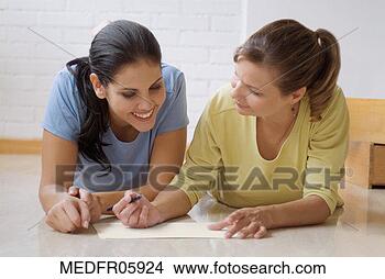 Stock Photo - two women discussing 
home improvement. 
fotosearch - search 
stock photos, 
pictures, images, 
and photo clipart