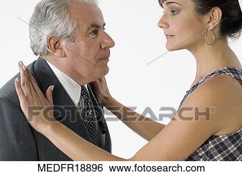 Stock Photo - young woman with 
her hands on an 
elderly man's 
shoulders. fotosearch 
- search stock 
photos, pictures, 
images, and photo 
clipart