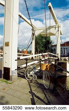 Stock Photography - bicycle parked 
at a drawbridge, 
amsterdam, netherlands. 
fotosearch - search 
stock photos, 
pictures, images, 
and photo clipart
