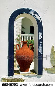 Stock Photo - decorative vase 
placed on an arched 
window of a house, 
 santorini. fotosearch 
- search stock 
photos, pictures, 
images, and photo 
clipart