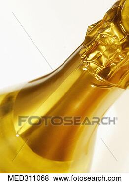 Stock Photo - close-up of a 
bottle of gold 
foil on a bottle 
of champagne. 
fotosearch - search 
stock photos, 
pictures, images, 
and photo clipart