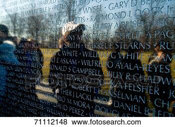 Stock Photo - people reflected 
in the wall of 
the vietnam veterans 
memorial. fotosearch 
- search stock 
photos, pictures, 
images, and photo 
clipart