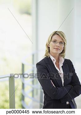 Stock Image - businesswoman 
standing with 
arms crossed. 
fotosearch - search 
stock photos, 
pictures, images, 
and photo clipart