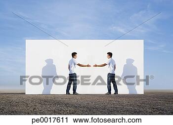 Stock Photography - man shaking hands 
with no one outdoors 
in front of wall. 
fotosearch - search 
stock photos, 
pictures, images, 
and photo clipart