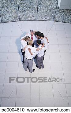 Stock Photography - aerial view of 
six office workers 
huddling together. 
fotosearch - search 
stock photos, 
pictures, images, 
and photo clipart