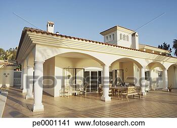 Stock Photography - building with 
columns and patio 
furniture on pool 
deck. fotosearch 
- search stock 
photos, pictures, 
images, and photo 
clipart