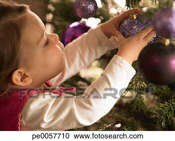 Stock Photography - a child decorating 
a christmas tree. 
fotosearch - search 
stock photos, 
pictures, images, 
and photo clipart