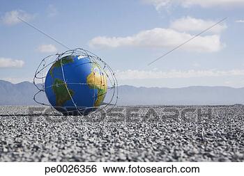 Stock Photo - a globe entangled 
in barbed wire. 
fotosearch - search 
stock photos, 
pictures, images, 
and photo clipart