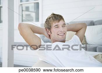 Stock Photography - man sitting outdoors 
relaxing and smiling. 
fotosearch - search 
stock photos, 
pictures, images, 
and photo clipart