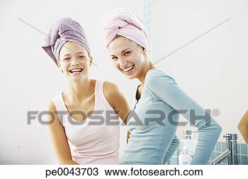 Stock Photo - two girlfriends 
in a bathroom 
together. fotosearch 
- search stock 
photos, pictures, 
images, and photo 
clipart