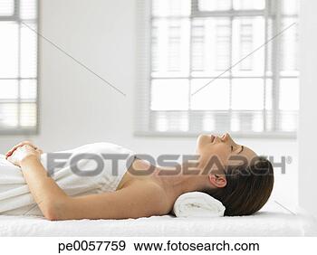 Stock Photograph - a woman lying 
in a spa. fotosearch 
- search stock 
photos, pictures, 
images, and photo 
clipart