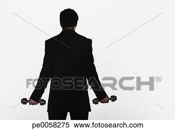 Stock Image - businessman holding 
two small free 
weights. fotosearch 
- search stock 
photos, pictures, 
images, and photo 
clipart