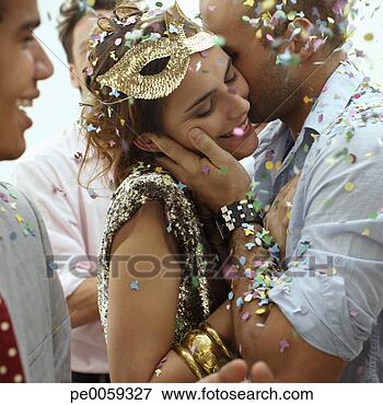 Picture - couple kissing 
at a party. fotosearch 
- search stock 
photos, pictures, 
images, and photo 
clipart